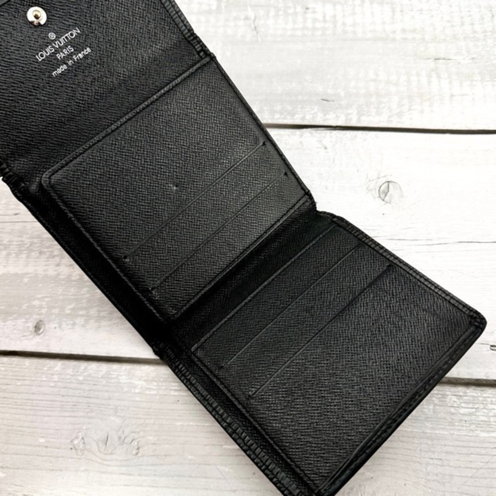 AUTHENTIC Louis Vuitton Marco Wallet. Previously owned. Color: Black